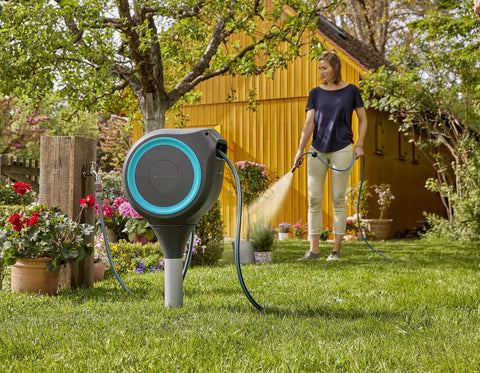 Automatic Retractable Garden Hose Reel With 50 Feet Of Easy Retracting Hose 360 Degree Swivel Metal Spike Base in garden