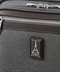 Close-up of logo and zipper on Underseat Spinner Tote With USB Port For Easy Travel 16 Inch Carry On Luggage In Vintage Grey