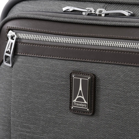 Close-up of logo and zipper on Underseat Spinner Tote With USB Port For Easy Travel 16 Inch Carry On Luggage In Vintage Grey
