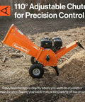 4-Inch Wood Chipper Shredder Mulcher with 9HP gas engine and adjustable chute in yard setting.