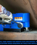Patented quill feed arbor of Ultra Low Profile Right Angle Magnetic Drill Fabricator Kit in use on metal surface.