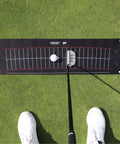 Putting Arc Golf Training Aid For A Perfect Stroke Adjustable Arc Practice Mat on grass with putter and golf ball