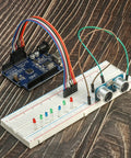Solderless Prototype Breadboard Kit With 1x830 Tie In Grid, 2x400 Tie Points, And 6x170 Tie Points assembled with electronic components.