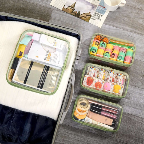 Heavy Duty Clear Hard Shell Zipper Pouches Built Different Stackable Travel Organizers for toiletries and makeup, various sizes.
