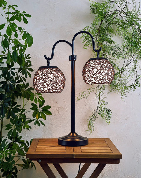 Castillo Outdoor Table Lamp in Oil Rubbed Bronze with Woven Rattan Shades, Rustic Two-Light 29 Inch Patio Lamp on wooden table
