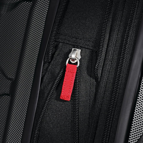 Samsonite Omni PC hardside carry-on luggage, black, close-up of red zipper pull, 20-inch