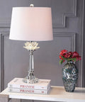 Clear Crystal LED Table Lamp 24.5 Inches With White Linen Drum Shade on a side table with books and vase