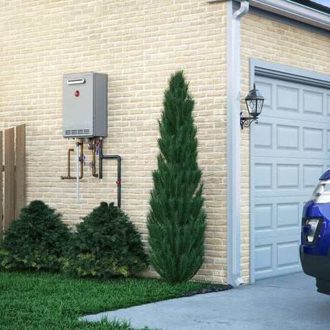 Instant Heat On Demand Outdoor Natural Gas Tankless Water Heater 6.8 Gpm mounted on a brick wall beside greenery.