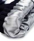 Close-up of Satin Lined Beanie With Pom For Women That Keeps Curls Frizz Free, showing plush inner satin lining for smooth curls.