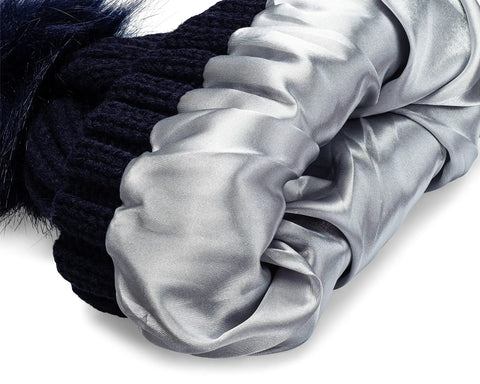 Close-up of Satin Lined Beanie With Pom For Women That Keeps Curls Frizz Free, showing plush inner satin lining for smooth curls.
