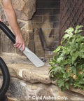 Person using vacuum with HEPA Cartridge Filter For Ash Vacuum - Dry Ash Filtration to clean ashes from fireplace