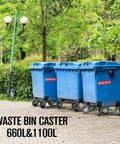 Set of four blue plastic waste bins on wheels outdoors among trees