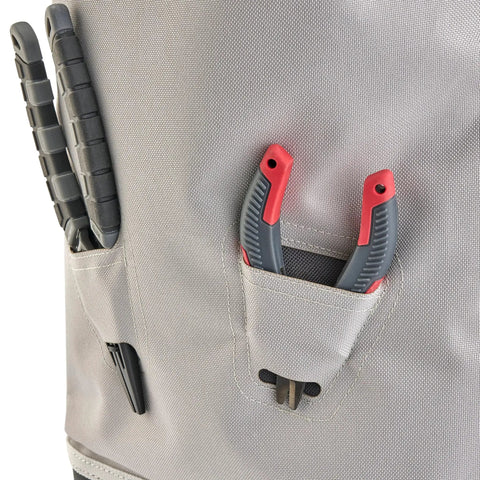 Close-up of Weekend Warrior Tackle Backpack 3700 Series showing tool pockets with tools against durable gray material.