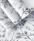 Gray Peel And Stick Floral Wallpaper Self Adhesive Vinyl With Waterproof And Removable Backing For Easy Install On Walls Cabinets Bathrooms And Bedrooms No Residue And Strong Adhesion Twenty Four Square Feet showing rolled edges and gray magnolia design close-up