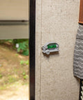 Retro RV Leveling Pack with front to back and side to side on point precision mounted on RV wall near wooded area