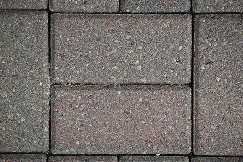 Close-up of textured stone pavers showing surface details, ideal for Premium Patio Paver Sealer Low Gloss Water Based Clear Stone Sealant Tough As Nails For Driveways.