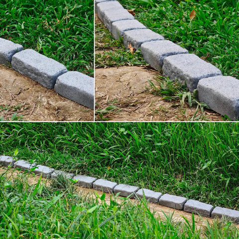 Realistic Faux Stone Landscape Edging Kit With 24 Bricks, 15.5 Ft Total shown bordering a garden with grass and soil