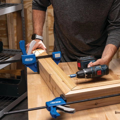 Gnarly Quick Grip Bar Clamps 12 Inch Heavy Duty Woodworking Tool 300 Lb Capacity GripMaxx Tech in use for assembling timber.