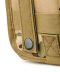 Close-up of Scherber Premium IFAK MOLLE trauma pouch in woodland camouflage with tan webbing and snap button