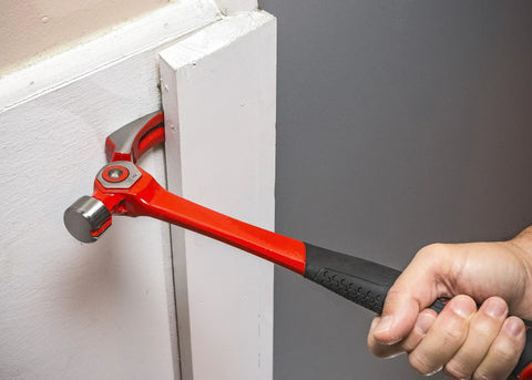 Person using 18 Oz Steel Indexing Claw Hammer With Cushion Grip Handle For Nail Driving Magnetic Nail Starter And Four Position Leverage