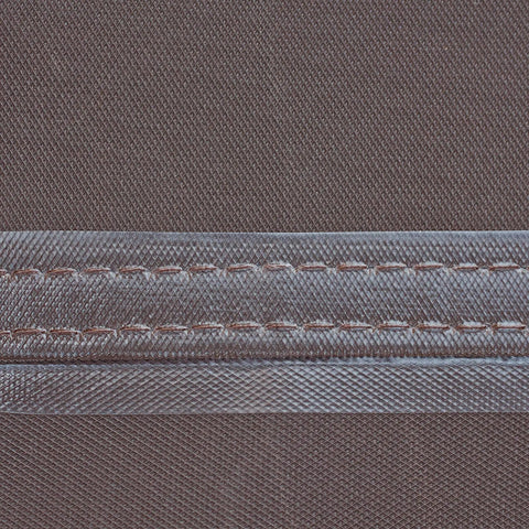 Close-up view of Ultimate Waterproof Round Patio Table And Chair Set Cover showing weatherproof fabric and taped seams.