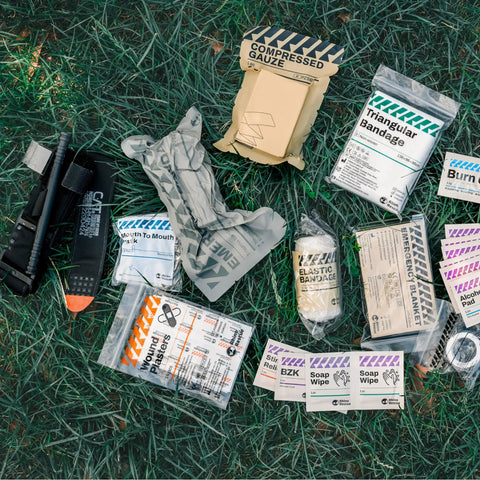IFAK Trauma Kit With CAT Tourniquet And Israeli Bandage Wound Care Essentials In MOLLE Pouch, field components displayed
