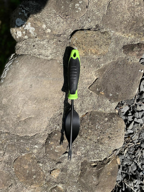 Heavy Duty Weeding Tool With Lever Design Weed Puller on stone surface, featuring a two pronged V shaped fork and ergonomic handle