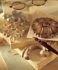 Pebeo Gilding Wax King Gold front view: three gilded floral medallions.