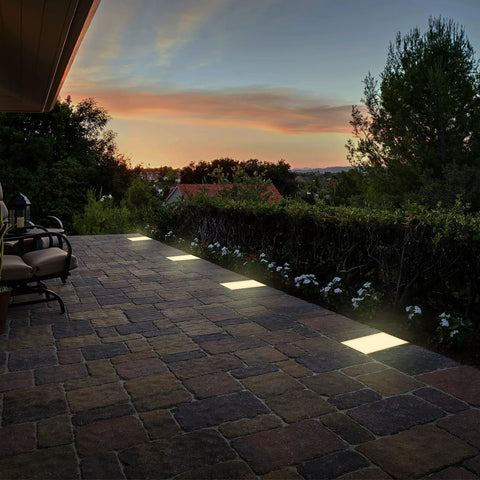 Dope 9 By 12 Inch Paver Light For Driveways And Patios With 2700K Warm White Glow illuminating patio at sunset