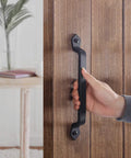 Hand holding Rustic Barn Door Handle 11 Inch Cast Iron Sliding Gate Pull Black Heavy Duty Fence Door Hardware
