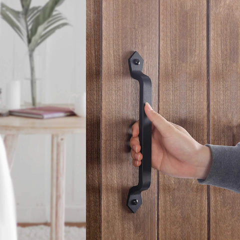 Hand holding Rustic Barn Door Handle 11 Inch Cast Iron Sliding Gate Pull Black Heavy Duty Fence Door Hardware