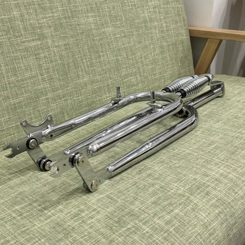 26 Inch Springer Fork For Cruiser Bicycles With Dual Spring Suspension, 1 Inch Threaded Steering, Chrome Finish, on green fabric