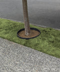 Built Tough Sturdy Circular Tree Ring Edging Kit For Landscapes Made With Corten Steel Keeps Roots In Check Wont Bend Or Shift In Wind Bug Resistant Easy Circle Shape Durable Outdoor Barrier For Healthy Tree Growth installed around a tree.