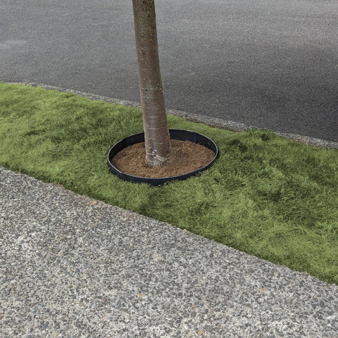 Built Tough Sturdy Circular Tree Ring Edging Kit For Landscapes Made With Corten Steel Keeps Roots In Check Wont Bend Or Shift In Wind Bug Resistant Easy Circle Shape Durable Outdoor Barrier For Healthy Tree Growth installed around a tree.