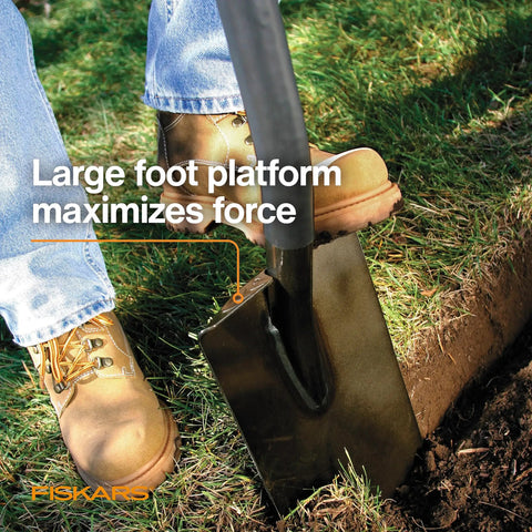 Beefy Heavy Duty Garden Shovel With Straight Handle For Digging In Tough Soil, user pressing shovel with foot on grass