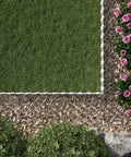 Top view of Picket Border Fence Kit 24.9 Foot White Outdoor Garden Fence in a yard, with grass, flowers, and decorative wood chips.