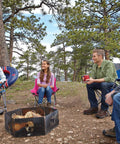 Group sitting around fire pit with Oversize Camping Chair With Cup Holder And Side Pocket, perfect for outdoor activities.