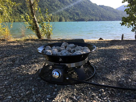Portable Propane Fire Pit 21 Inch Smokeless Gas Firebowl With 58,000 BTU No Mess Campfire by a lakeside