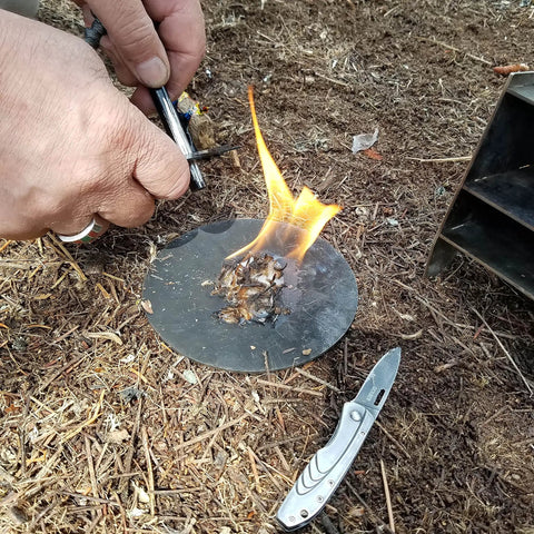 Using FireRope Tinder Weatherproof Firestarter for camping and survival quick ignition with lighter or matches outdoors.