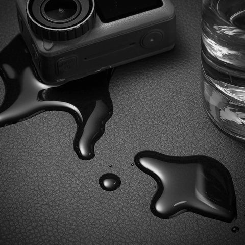 Leather Desk Blotter Pad 17 By 12 Inches Flat Non Slip Waterproof Black With Velvet Back, shown with spills to highlight waterproof feature
