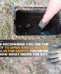 Person using Long Reach 48 Inch Water Meter Key With Wide T Handle For Easy Valve Access in a ground box.