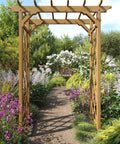 Cedar Wood Garden Arbor 55 By 88 Inches Golden Brown Arch With Lattice Trellis for Climbing Plants in a garden pathway.