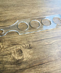 Ultra Clear Acrylic Flight Paddle Template For Woodworking Router Jigs And Home Bar Trays Featuring Hella Accurate Cutouts and awesome craft beer vibes, laid on wood.