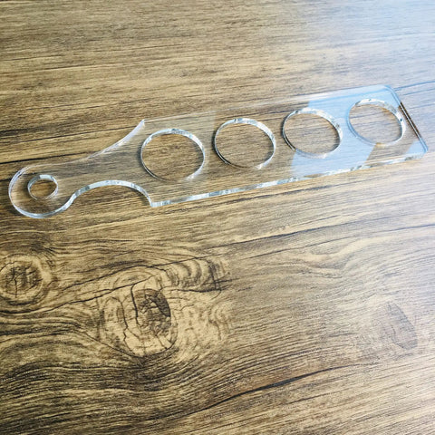 Ultra Clear Acrylic Flight Paddle Template For Woodworking Router Jigs And Home Bar Trays Featuring Hella Accurate Cutouts and awesome craft beer vibes, laid on wood.