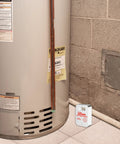 Compact Water Alarm With 360 Degree Sensing And 110 dB Siren detecting water near water heater in basement corner