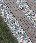 Interlocking Stone Deck Tiles 12x12 for Indoor Outdoor Use in Grey and White Real Pebble Slices installed on a grass pathway