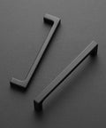 Solid 5 Inch Square Cabinet Handles Pack Of 45 Matte Black Drawer Pulls For Kitchen Cabinets Flat Black Hardware With 5 Inch Center To Center Spacing And Easy Install Go To Kitchen Upgrade showing dual handles on gray surface.