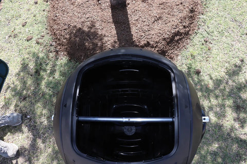 Top view of Ms Tumbles 35 Gallon Compost Tumbler With Easy Turn System, showing open lid and interior in black and green design.