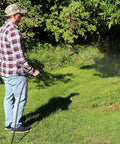 Farm Grade Adjustable Spray Gun With 50 Inch Reach, 18 Orifice, 150 Psi Max, 3 Gpm, in use by man watering plants