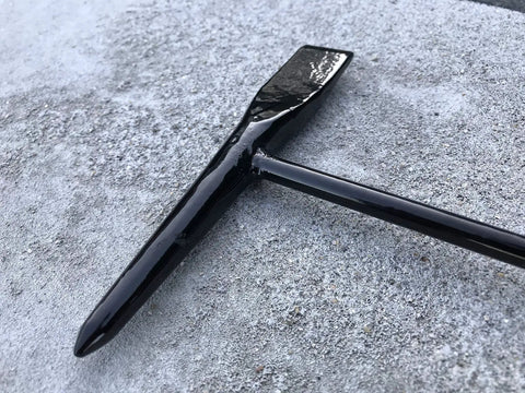 Tough As Nails Welding Chipping Hammer With Comfort Grip Spiral Handle And Anti Rust Tempered Steel Head close-up on surface.